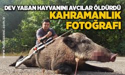 Dev yaban hayvanını avcılar öldürdü... KAHRAMANLIK FOTOĞRAFI