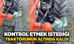 Kontrol etmek istediği traktörünün altında kaldı
