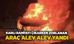 Karlı rampayı çıkarken zorlanan araç alev alev yandı