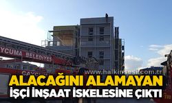 Alacağını alamayan işçi inşaat iskelesine çıktı