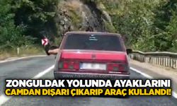 Zonguldak yolunda ayaklarını camdan dışarı çıkarıp araç kullandı!