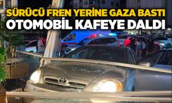 Sürücü fren yerine gaza bastı: Otomobil kafeye daldı
