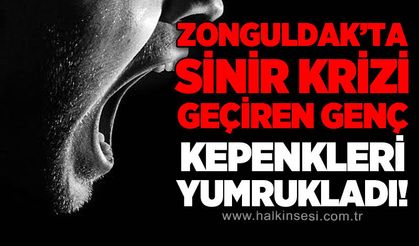 Zonguldak'ta sinir krizi geçiren genç kepenkleri yumrukladı!