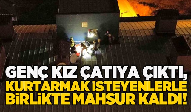 Genç kız çatıya çıktı, kurtarmak isteyenlerle birlikte mahsur kaldı!