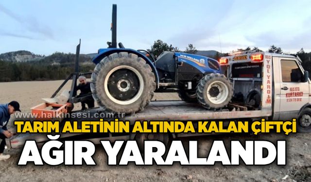 Tarım aletinin altında kalan çiftçi ağır yaralandı