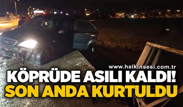 Köprü korkuluklarında asılı kalan cip nehre düşmekten son anda kurtuldu