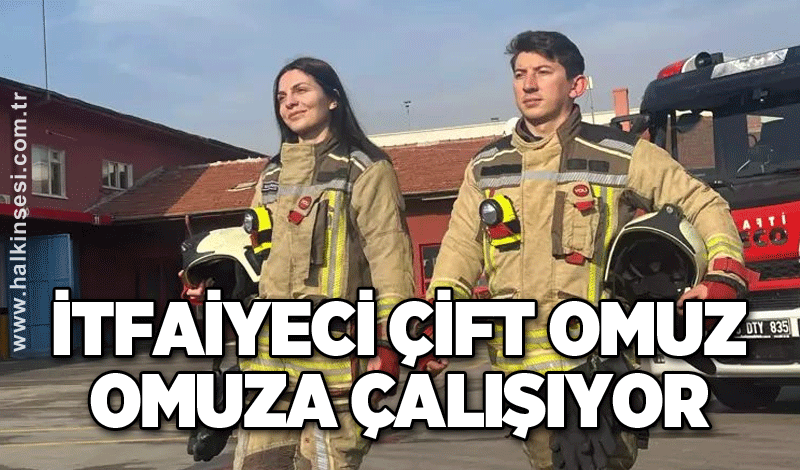 İtfaiyeci çift omuz omuza çalışıyor