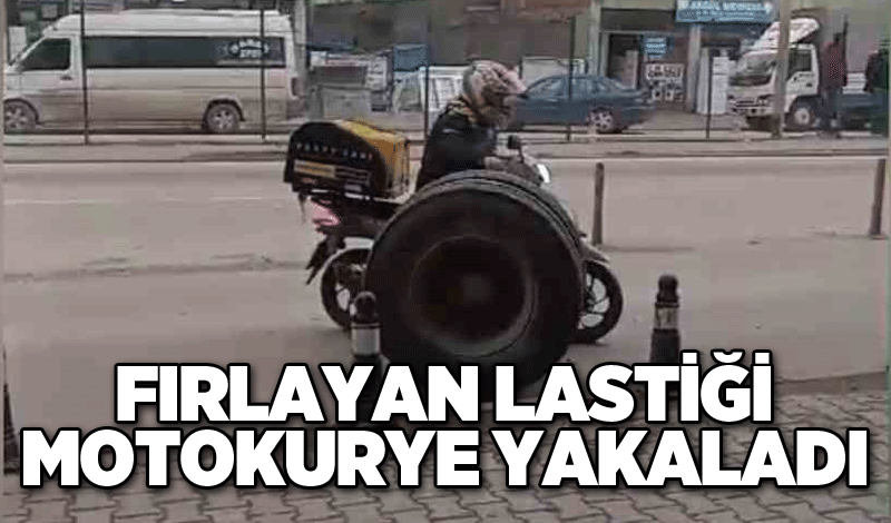 Kamyondan fırlayan lastiği motokurye yakaladı