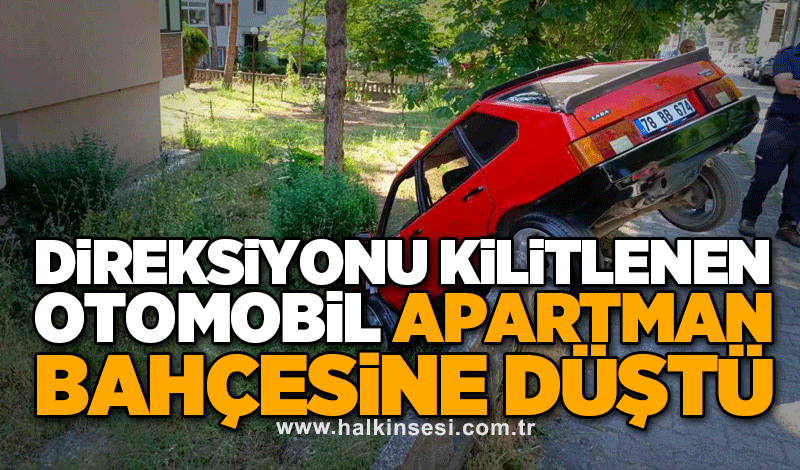 Direksiyonu kilitlenen otomobil apartman bahçesine düştü