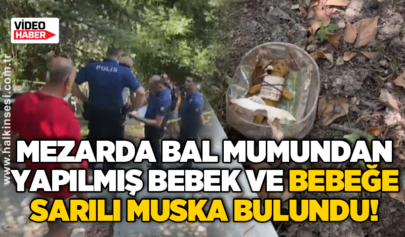 Mezarda bal mumundan yapılmış bebek ve bebeğe sarılı muska bulundu